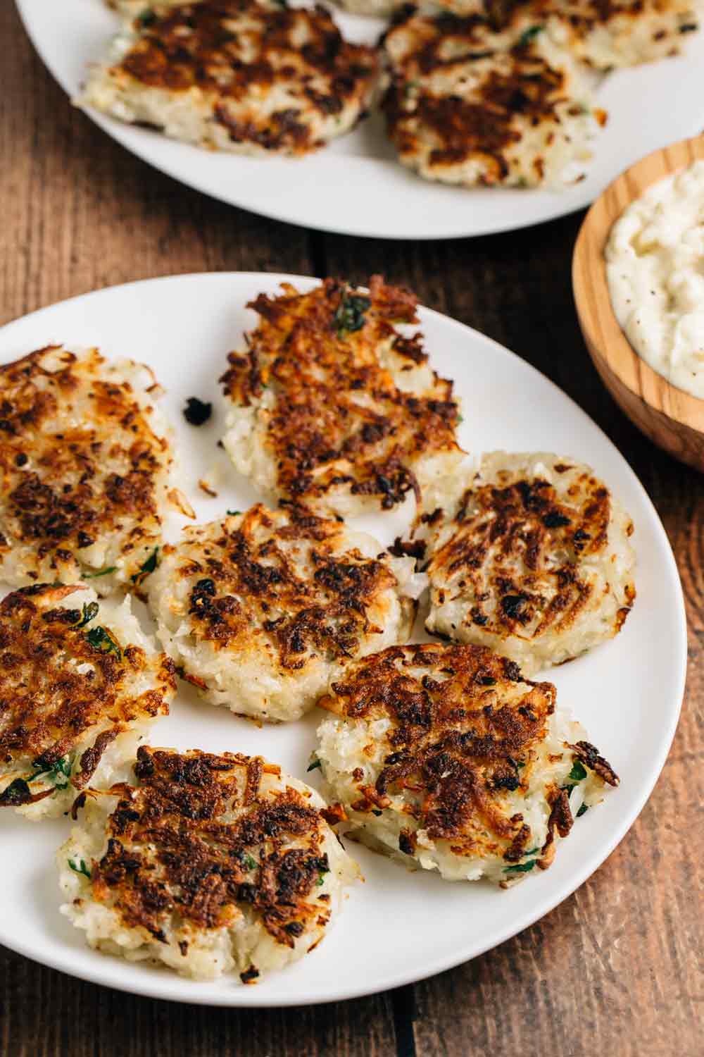 Potato Cauliflower Latkes with Horseradish Sauce | via veggiechick.com #vegan