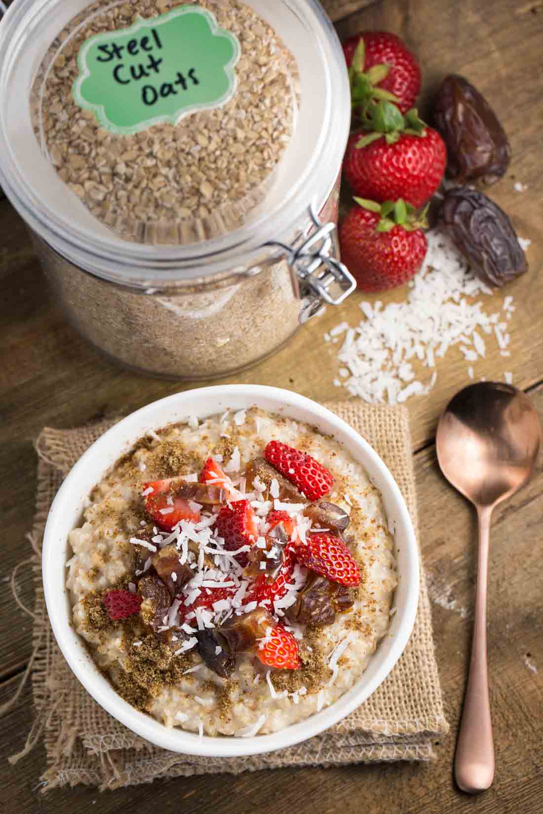 Steel cut oatmeal with strawberries, dates and brown sugar with toppings.