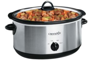 A slow cooker filled with vegetables and meat.