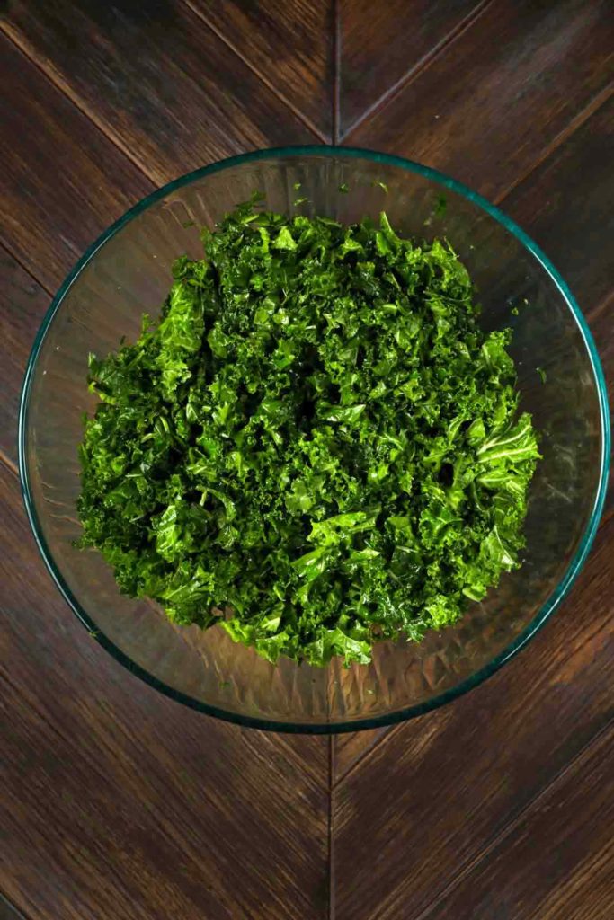 A bowl of finely chopped kale massaged with lemon juice and olive oil. 