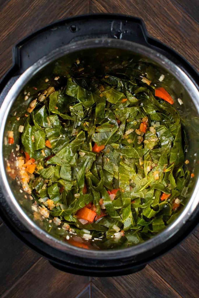 An instant pot filled with instant pot collard greens after cooking.